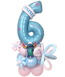 Balloon sculpture with a number '6' and a character on a white background