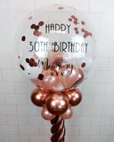 COLLECTION ONLY - Rose Gold Twisted Tower Topped with a Clear Bubble filled with Balloons & Confetti - Black Message