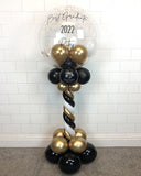 COLLECTION ONLY - Black, White & Gold Twisted Tower Topped with a Clear Bubble filled with Balloons & Gold Leaf - Black Message