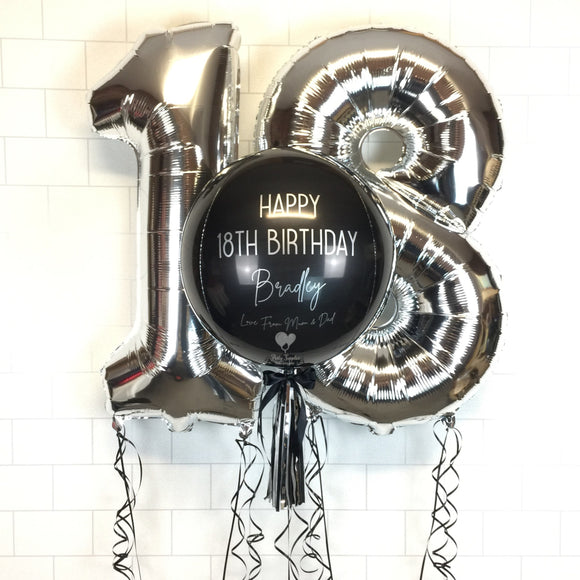 COLLECTION ONLY - Black Orbz Balloon, Personalised with a Silver Message Dressed with Tassel, Bow & Weight + 2 Large Silver Helium Filled Numbers