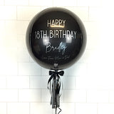 COLLECTION ONLY - Black Orbz Balloon, Personalised with a Silver Message Dressed with Tassel, Bow & Weight + 2 Large Silver Helium Filled Numbers