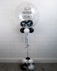 COLLECTION ONLY - Star Print Bubble Balloon filled with White & Black Balloons, Finished with a Black Personalised Message & Dressed with a Balloon Collar on a Balloon Base