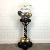 COLLECTION ONLY - Black, Silver & Gold Twisted Tower Topped with a Clear Bubble filled with Balloons & Gold Leaf - Black Message