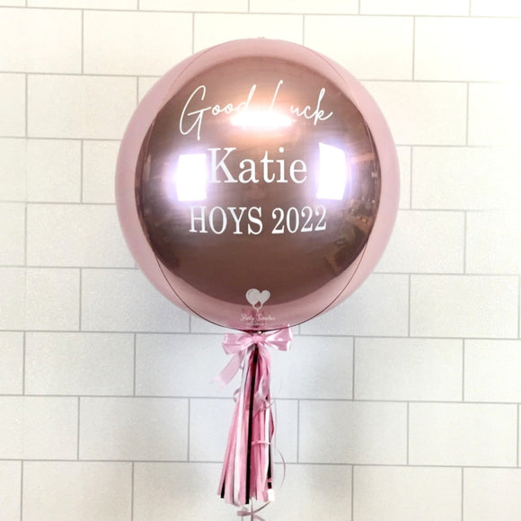 COLLECTION ONLY - Rose Gold Orbz Balloon, Personalised with a White Message Dressed with Tassel, Bow & Weight