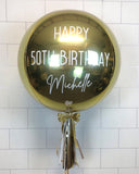 COLLECTION ONLY - White Gold Orbz Balloon, Personalised with a White Message Dressed with Tassel, Bow & Weight