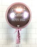 COLLECTION ONLY - Rose Gold Orbz Balloon, Personalised with a White Message Dressed with Tassel, Bow & Weight