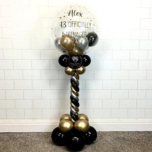 COLLECTION ONLY - Black, Silver & Gold Twisted Tower Topped with a Clear Bubble filled with Balloons & Gold Leaf - Black Message
