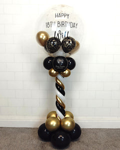 COLLECTION ONLY - Black, White & Gold Twisted Tower Topped with a Clear Bubble filled with Balloons & Gold Leaf - Black Message